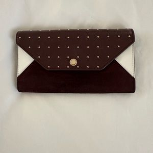 Maje wallet. color is wine or maroon. lots of room for credit cards, cash, coins